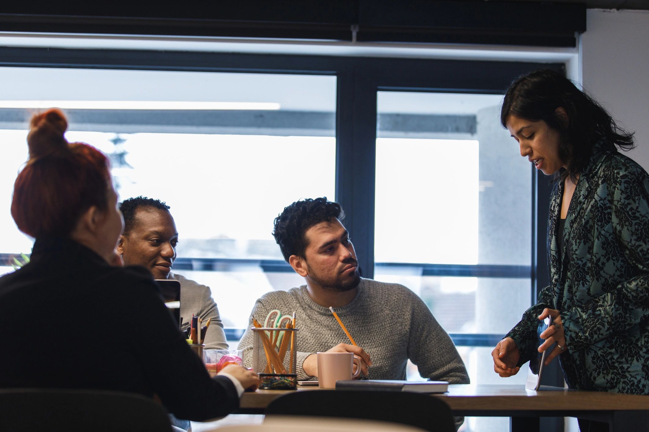 Consultant presenting information to a team