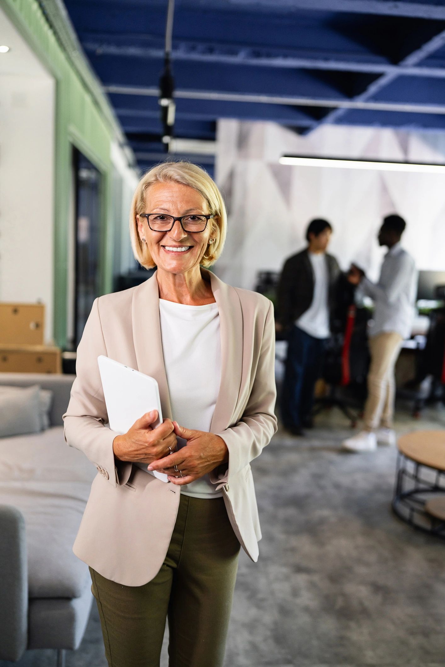 Senior education advisor holding a tablet