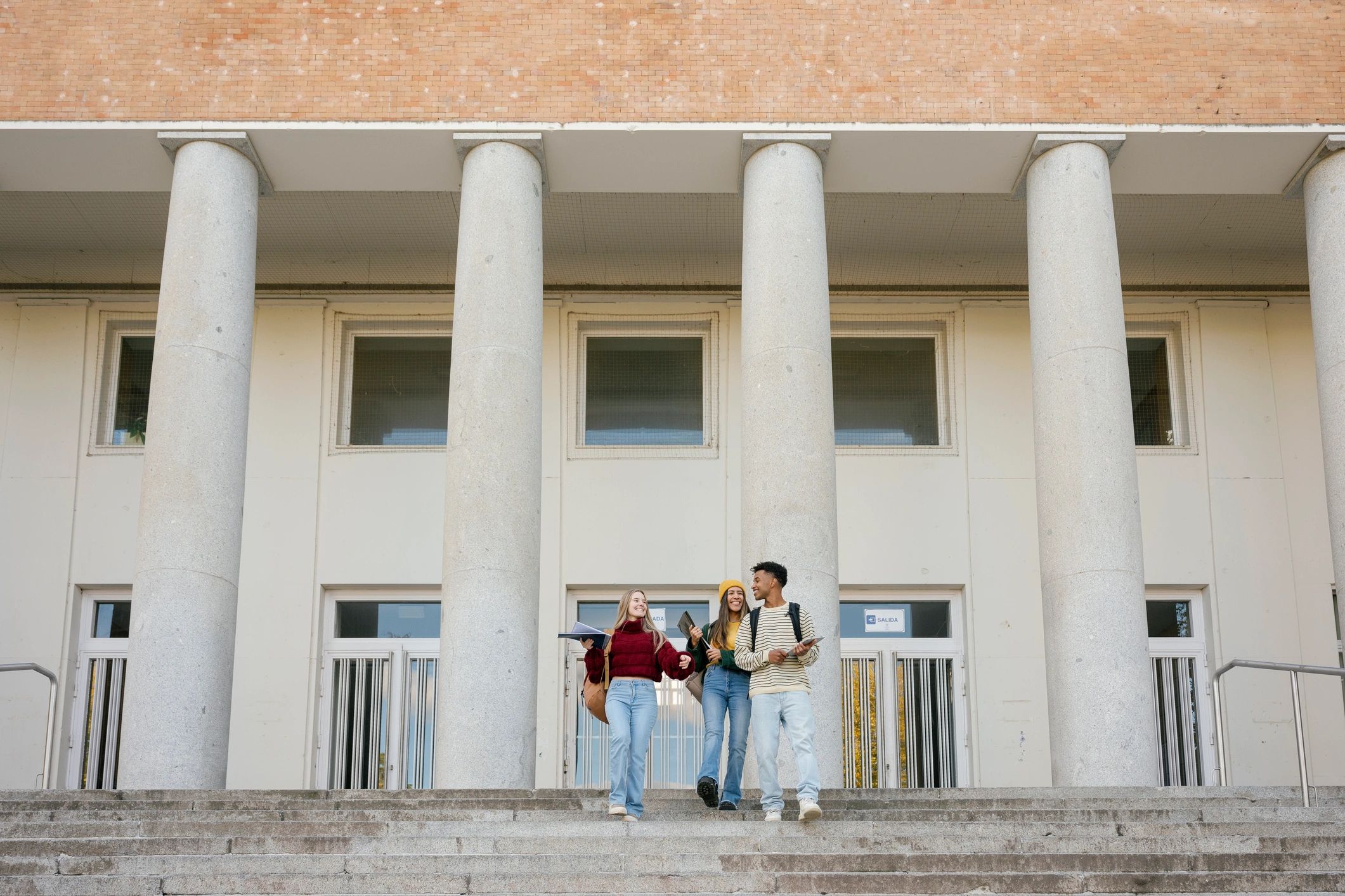 International students walking confidently on campus