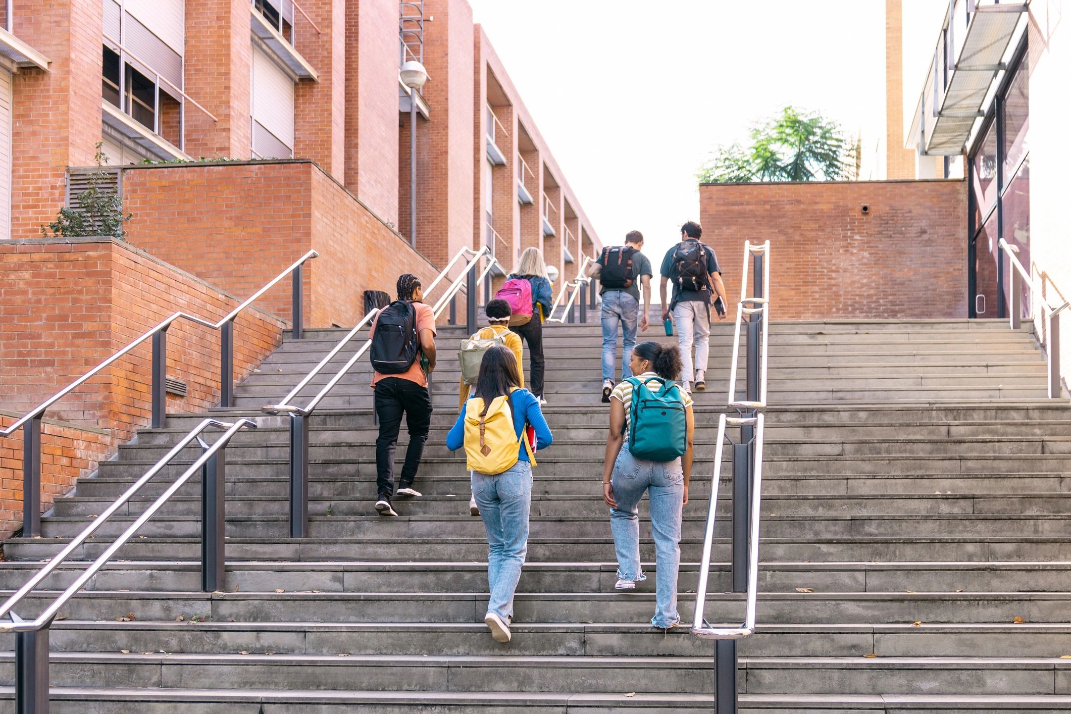 Students walking across a university campus