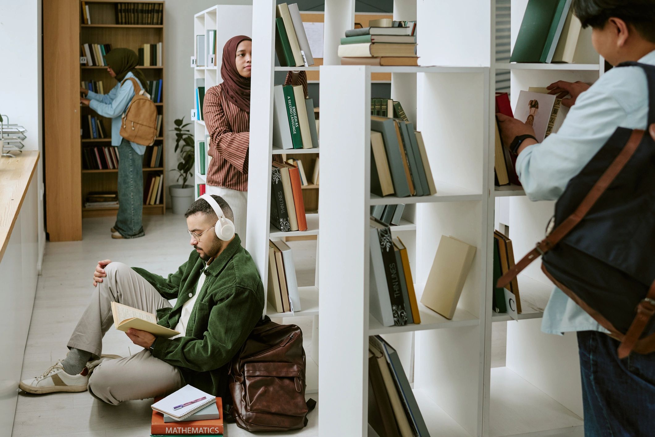 International students studying together in a library